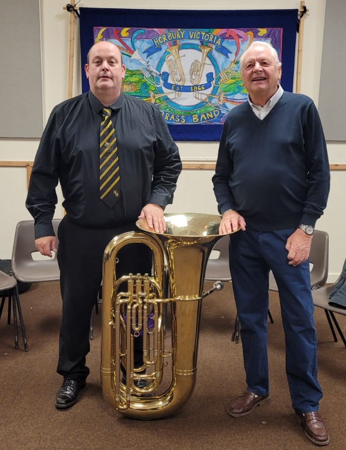 Our B♭ Bass player Nigel Hodson-Walker with a representative from the West Riding Masons